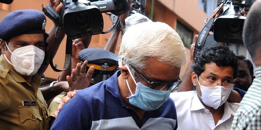 M Sivasankar enters the ED office in Kochi after being taken into custody by the central agency.