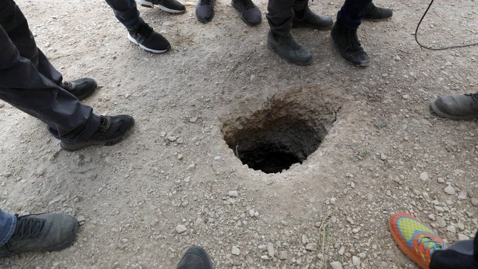 The tunnel emerged in a rural strip of land near the prison's walls