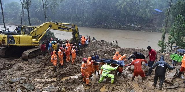 A body being recovered from the debris of the Kokkayar landslide at nearby Makochi in Idukki.