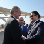 Iranian President Masoud Pezeshkian arrives in Iraq on his first foreign trip, aiming to boost relations amid regional tensions and sanctions.
