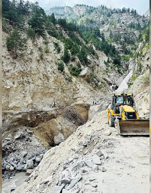 Labourers stranded in Himachal Pradesh due to snowfall and rock slides; road clearing efforts underway with heavy machinery.